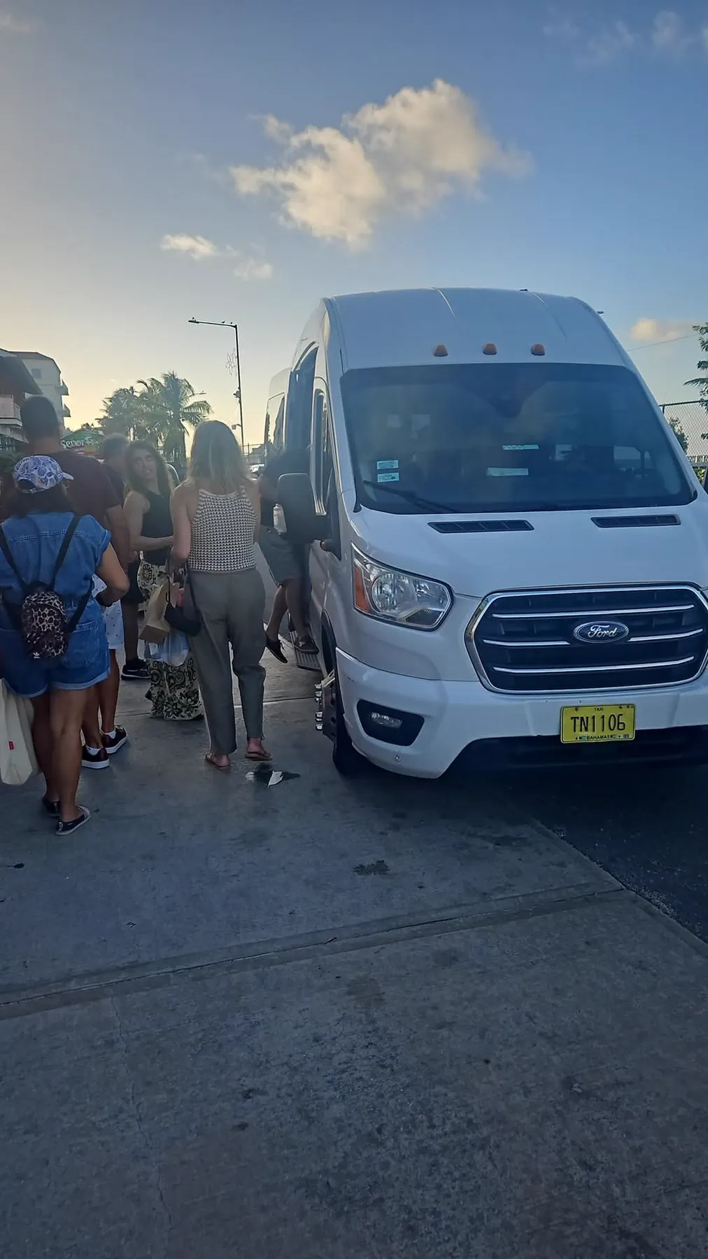 Guests boarding the van at sunset in Nassau