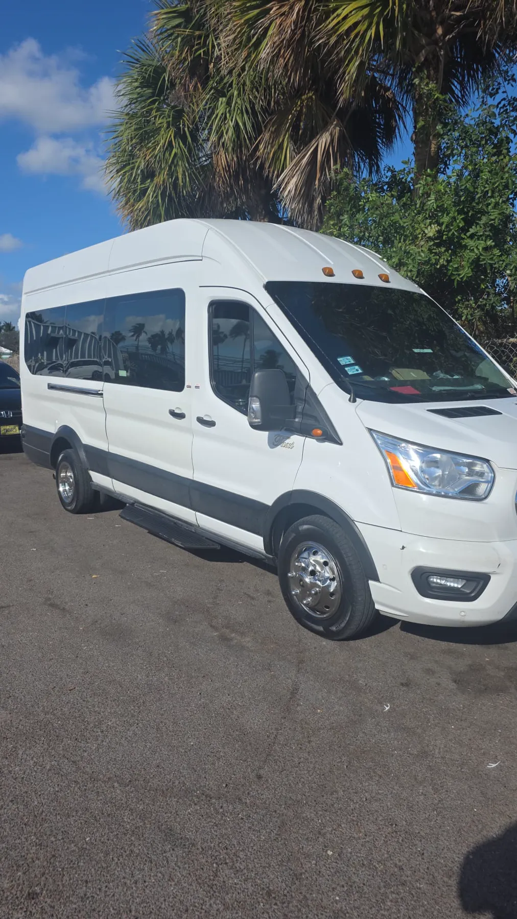 Scavella Transportation's white Ford Transit high-roof passenger van